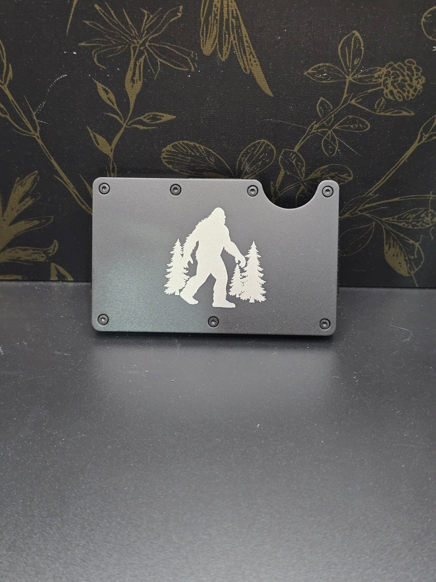 Gray metal wallet with a Bigfoot engraving
