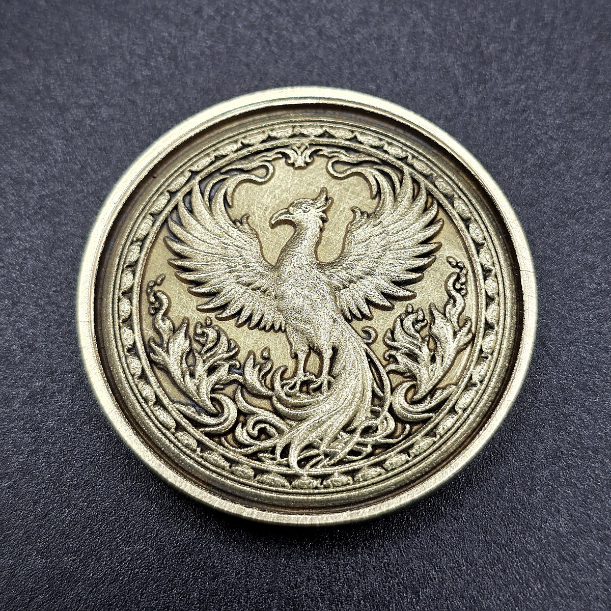 Phoenix brass coin, antiqued embossed finish