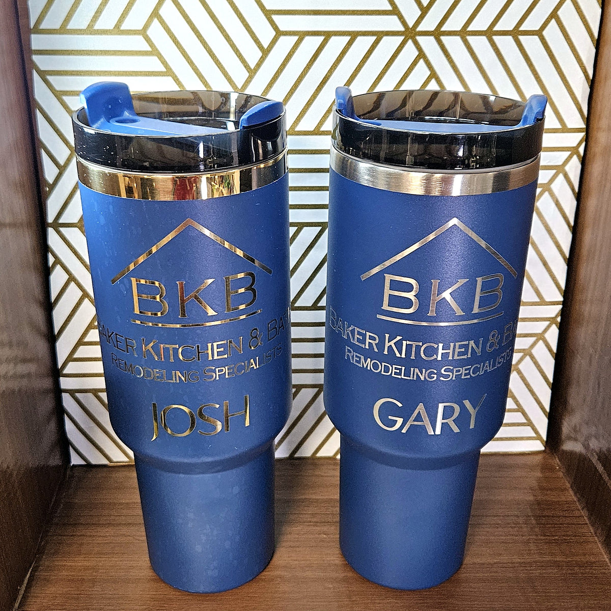Pair of blue 40oz tumblers engraved with business logo and names
